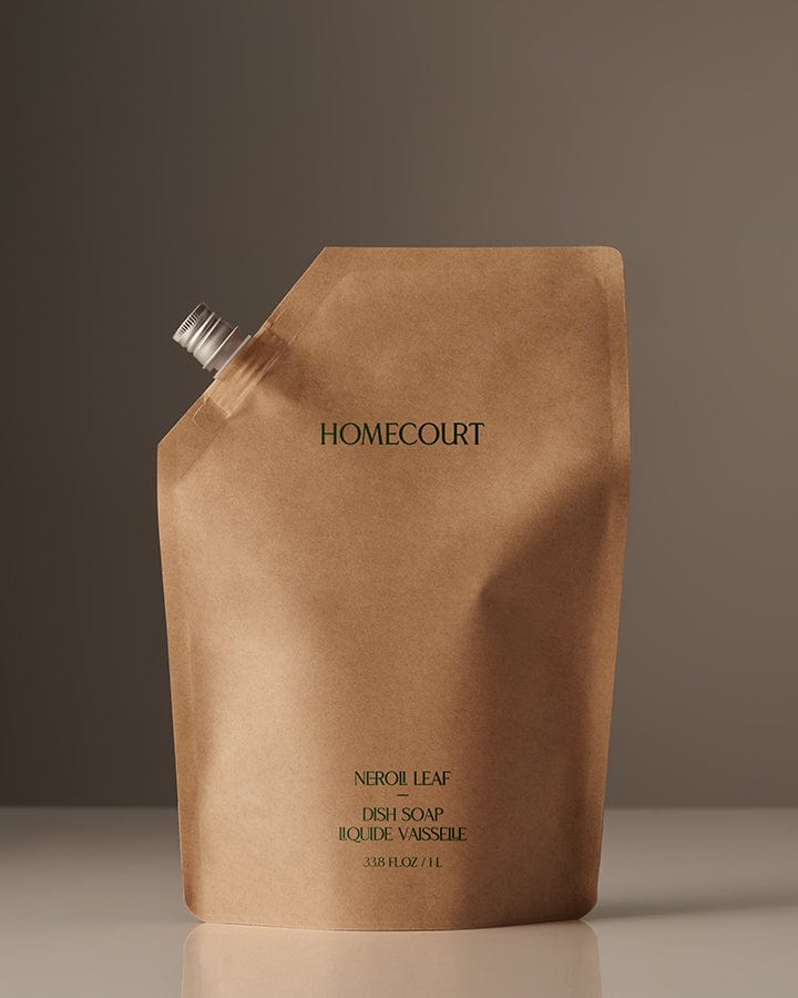 Brown Homecourt Award-Winning Dish Soap Refill packaging in Neroli Leaf Fragrance on a gray background.