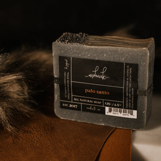 Bar of soap with a label on a dark background